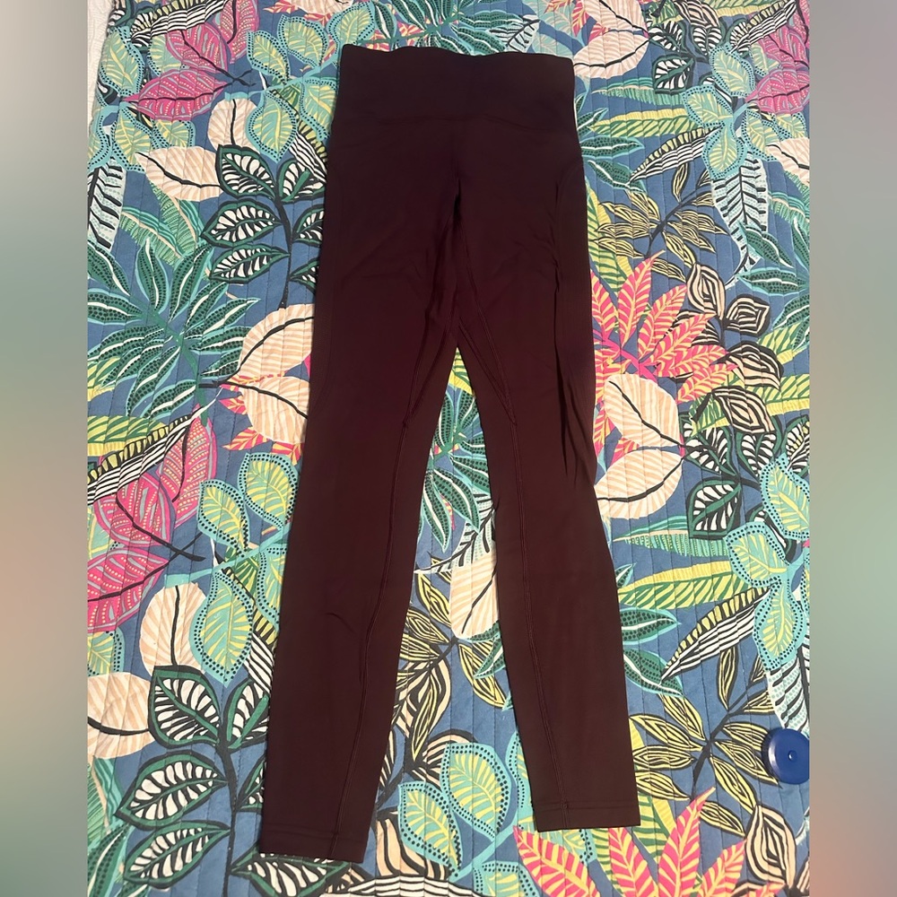 Lululemon cranberry/maroon color leggings.